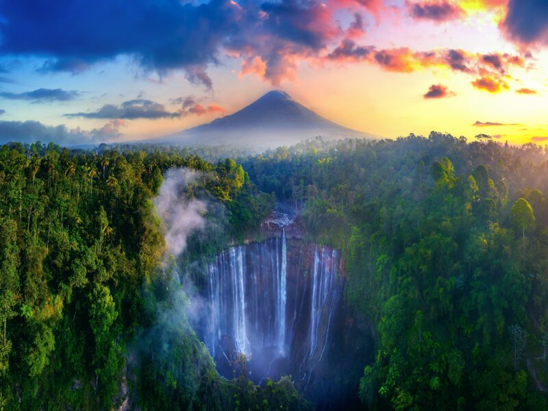 Tumpak,Sewu,Waterfall,And,Semeru,Mountain,At,Sunrise,,Indonesia.