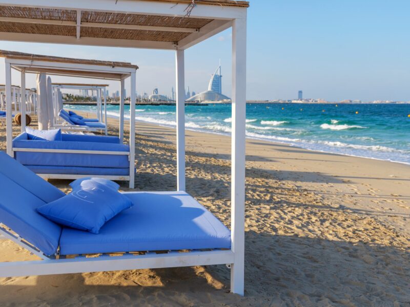Beach,Cabanas,With,Blue,Mattresses,On,A,Sandy,Shore,In